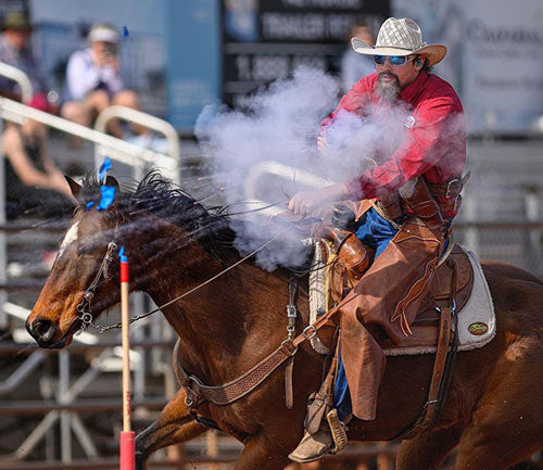 Horse and rider competing in mounted shooting