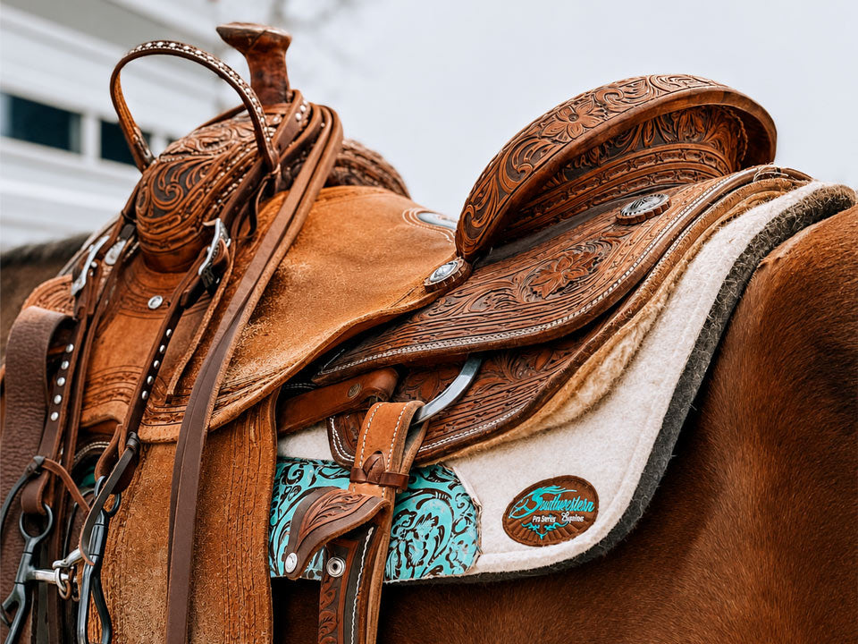 Western saddle and saddle pad on a horse